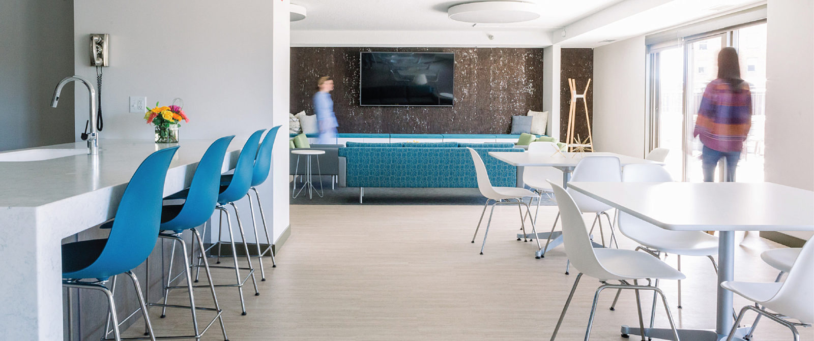 Modern lounge setting with classic furniture, lounge seating, and tables.